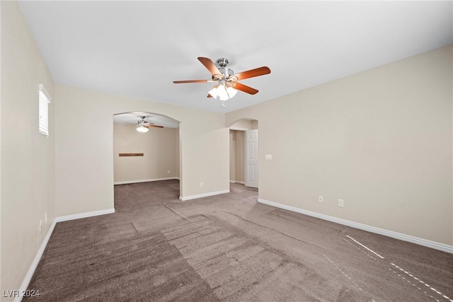 carpeted empty room with ceiling fan