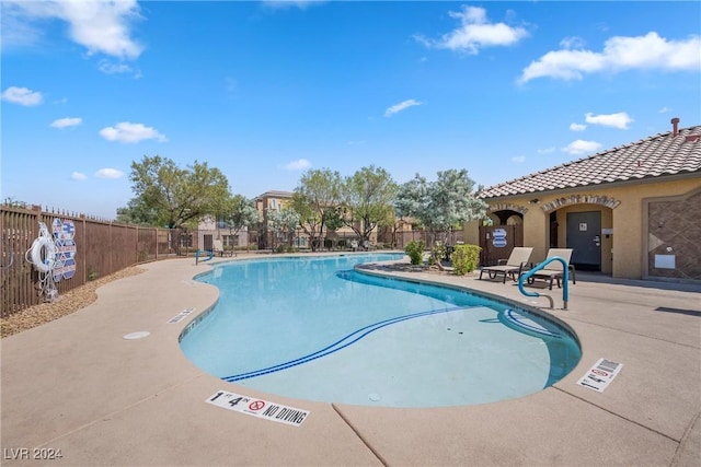 view of pool featuring a patio area