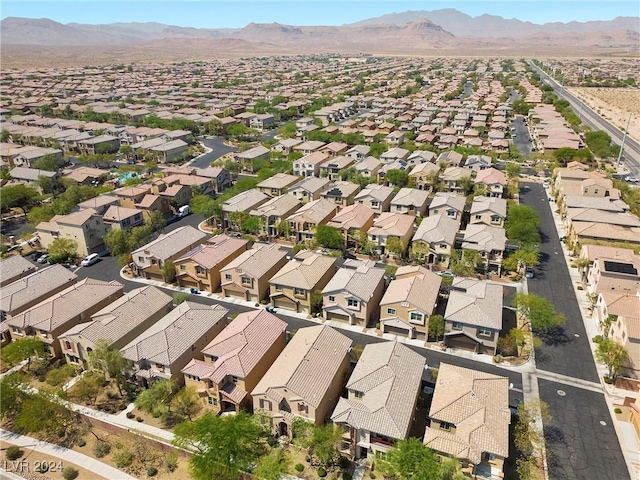 birds eye view of property with a mountain view