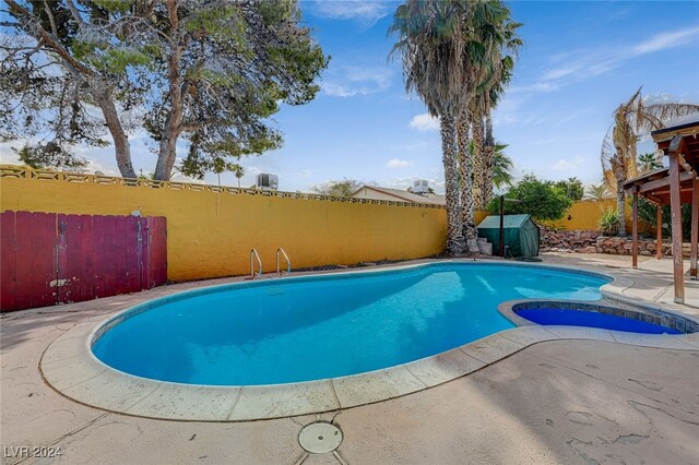 view of swimming pool with a patio area