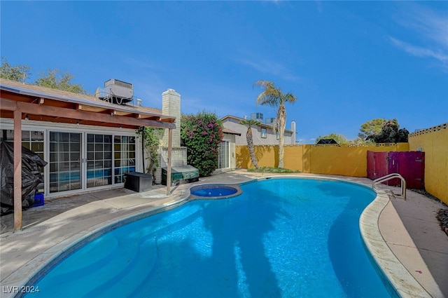 view of swimming pool with a patio area