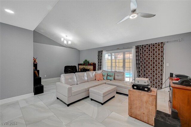 living room with ceiling fan and vaulted ceiling