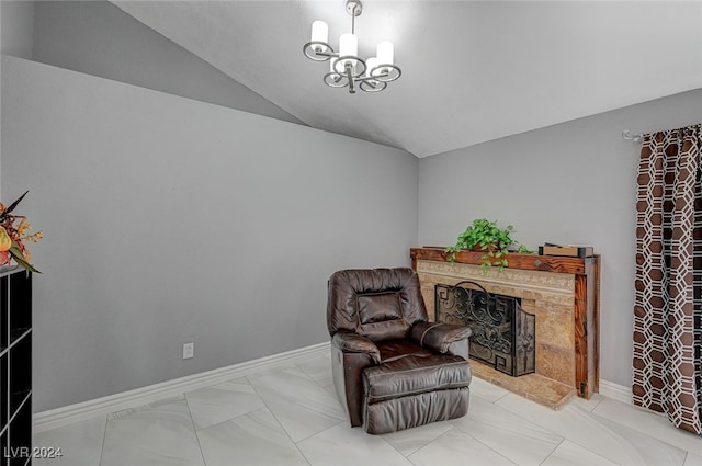 living area with vaulted ceiling and a notable chandelier