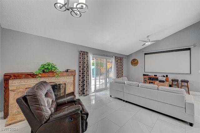 living room with lofted ceiling and ceiling fan with notable chandelier