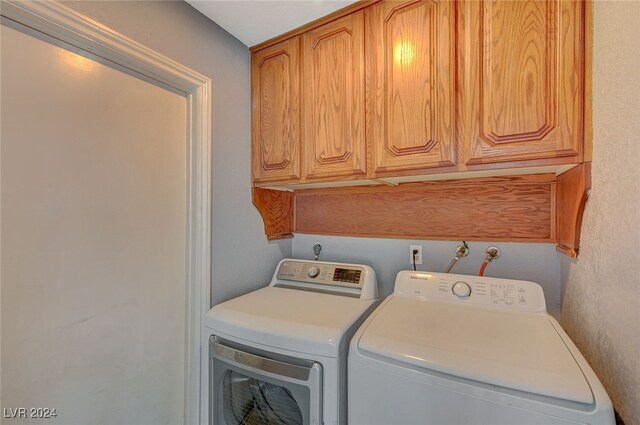 laundry room featuring cabinets and independent washer and dryer