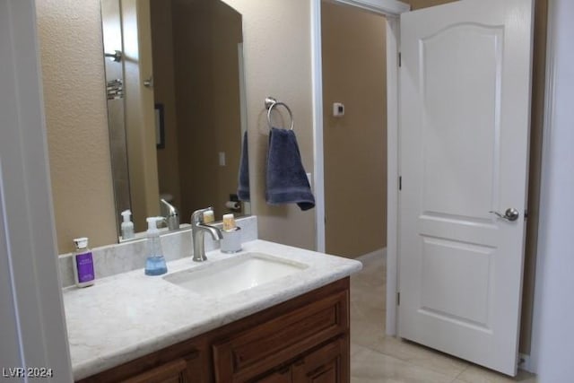 bathroom featuring vanity and tile patterned flooring