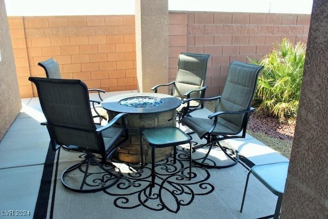 view of patio featuring a fire pit