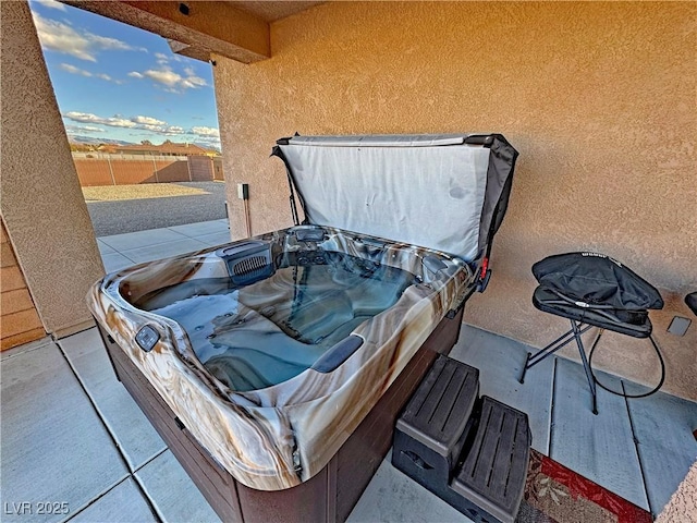 view of patio with a hot tub