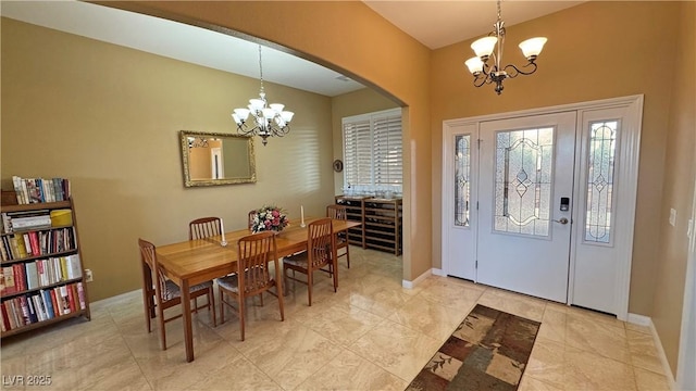 foyer entrance with an inviting chandelier