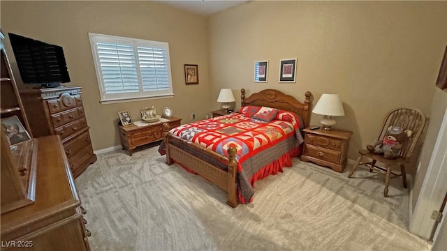 bedroom with light colored carpet