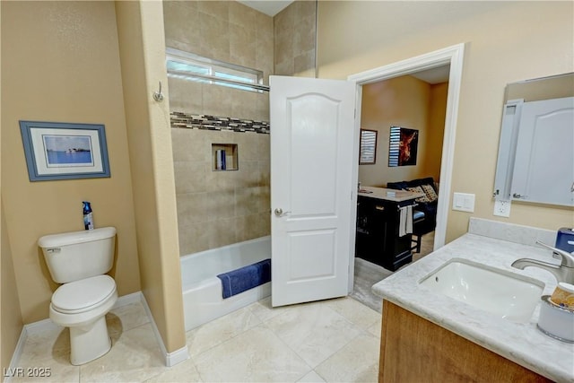 full bathroom featuring vanity, toilet, and tiled shower / bath combo