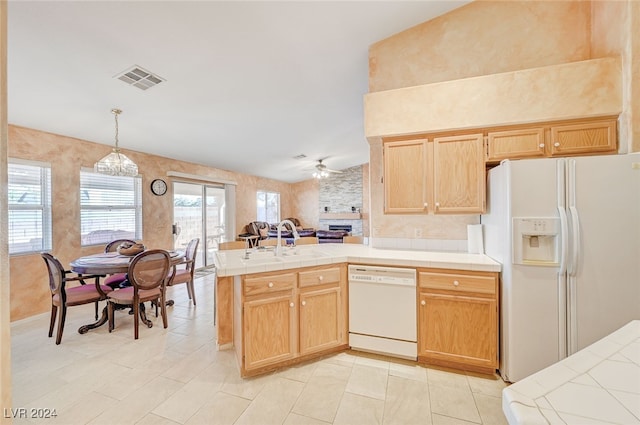 kitchen with white appliances, pendant lighting, kitchen peninsula, sink, and ceiling fan