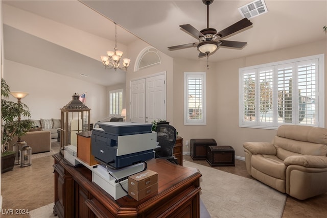 office featuring ceiling fan with notable chandelier and lofted ceiling