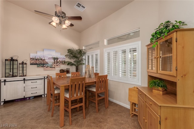 dining room featuring ceiling fan and lofted ceiling