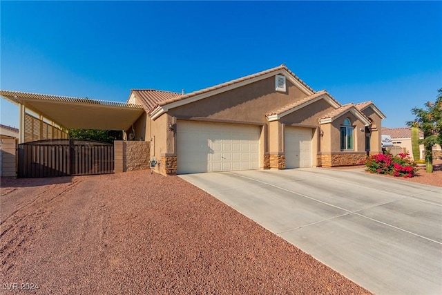 view of front facade featuring a garage and a carport