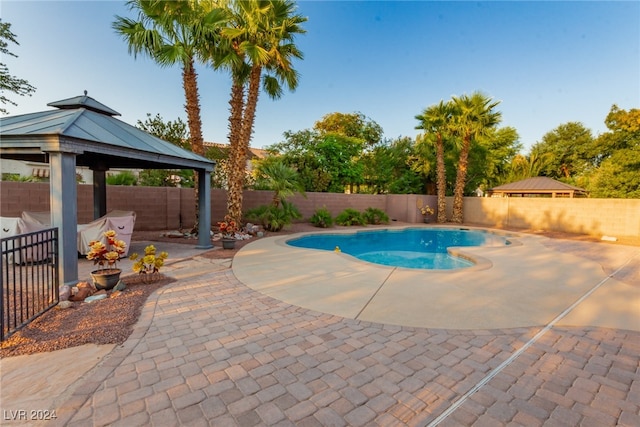 view of swimming pool with a gazebo and a patio