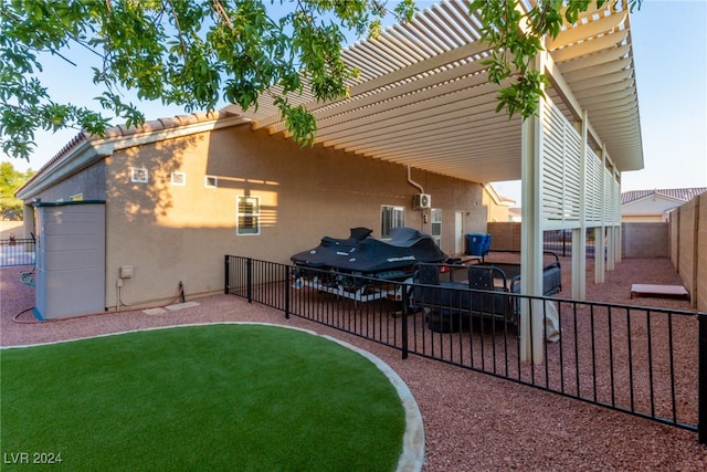 back of house with a patio area, a pergola, and a yard