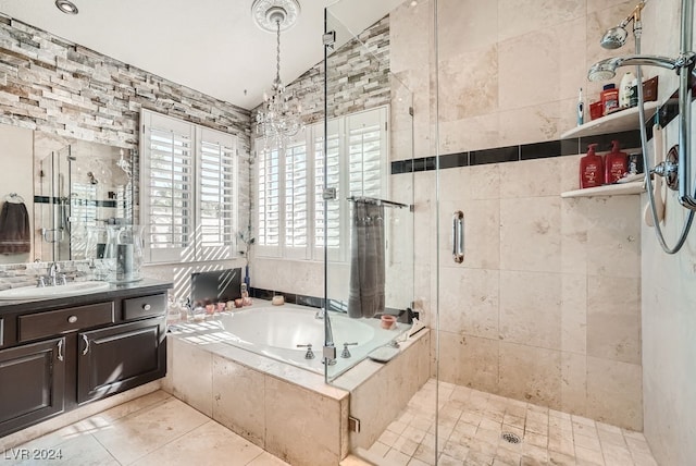 bathroom featuring tile patterned floors, vanity, tile walls, and shower with separate bathtub