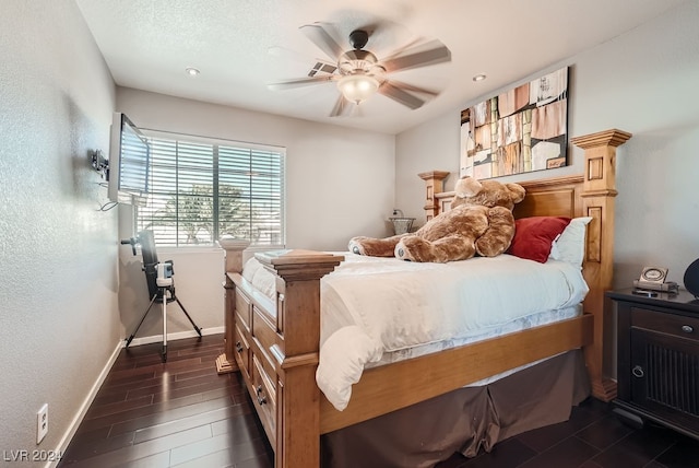 bedroom with ceiling fan and dark hardwood / wood-style flooring