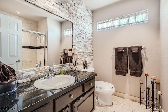 full bathroom featuring tile patterned flooring, a shower stall, toilet, and vanity