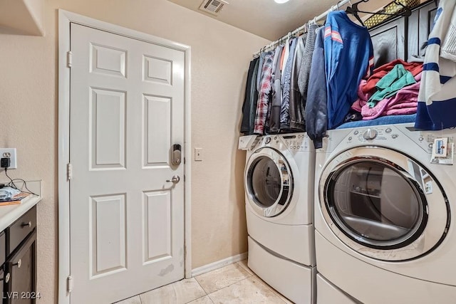 laundry room with light tile patterned floors, visible vents, and independent washer and dryer