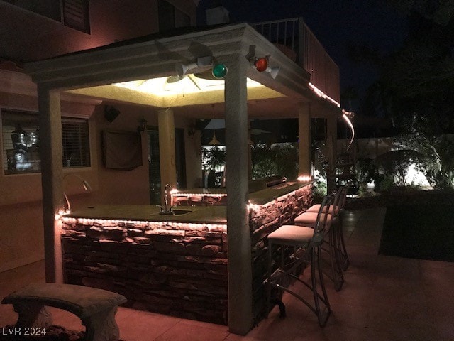 patio at night with an outdoor bar