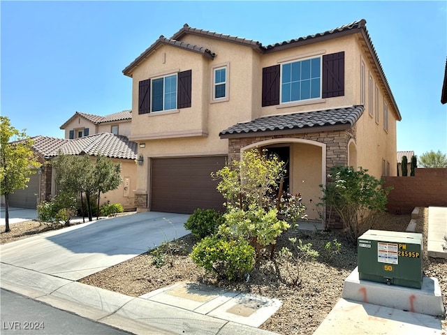 mediterranean / spanish-style house featuring a garage