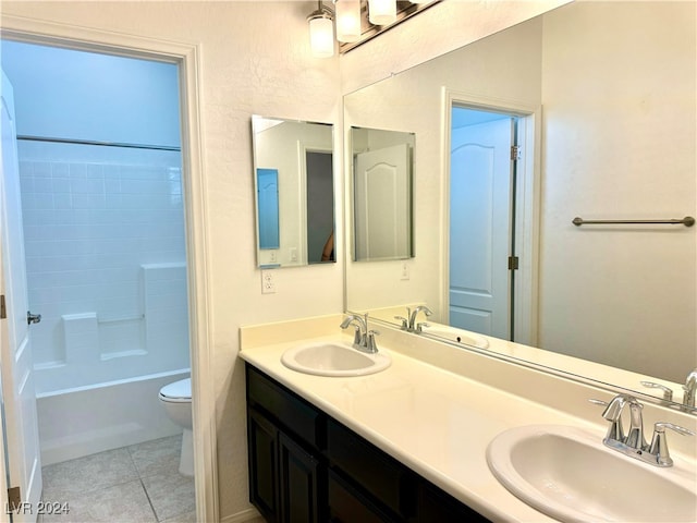 full bathroom featuring tile patterned flooring, vanity, toilet, and shower / washtub combination