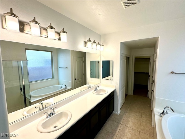 bathroom featuring tile patterned flooring, vanity, and separate shower and tub