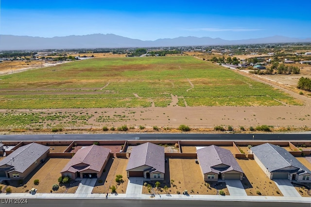 drone / aerial view featuring a mountain view and a rural view