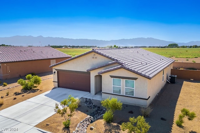 view of front of home featuring a garage and a mountain view