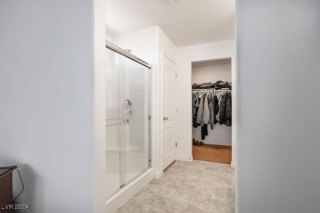 bathroom featuring an enclosed shower