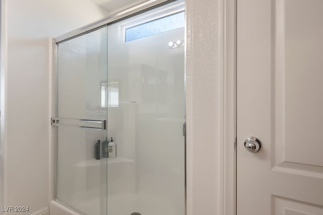 bathroom featuring an enclosed shower