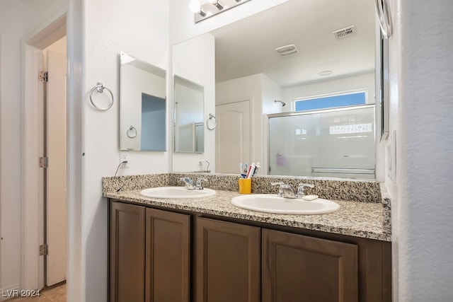 bathroom featuring vanity and walk in shower