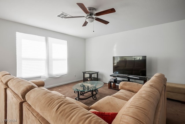 living room featuring carpet flooring and ceiling fan