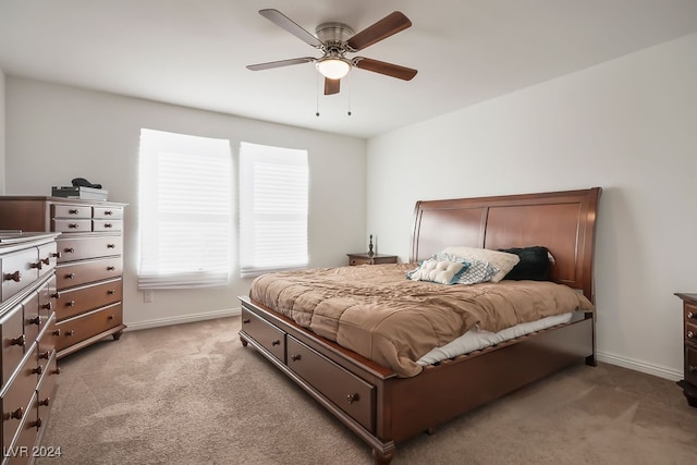 bedroom featuring ceiling fan and light colored carpet