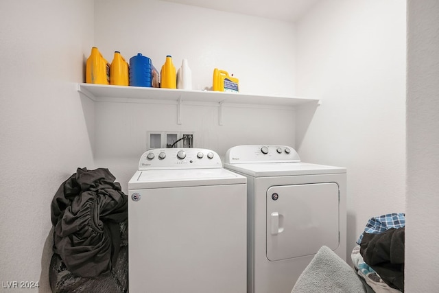 laundry area with washing machine and clothes dryer