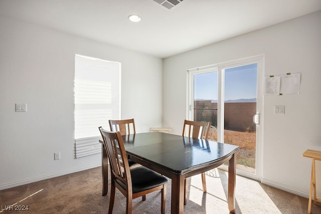 view of carpeted dining area