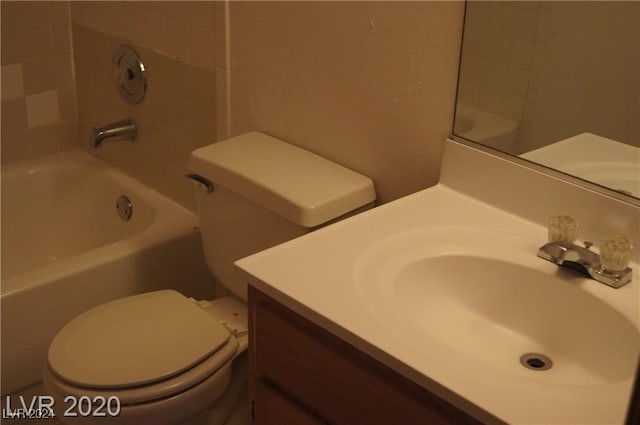 full bathroom featuring vanity, toilet, and tiled shower / bath combo