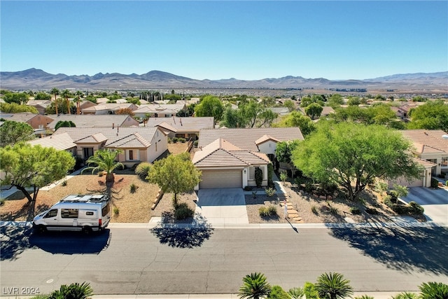 birds eye view of property featuring a mountain view