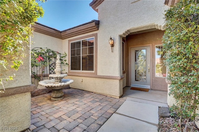 doorway to property featuring a patio area