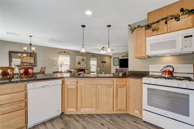 kitchen featuring ceiling fan with notable chandelier, white appliances, light hardwood / wood-style flooring, sink, and light brown cabinets