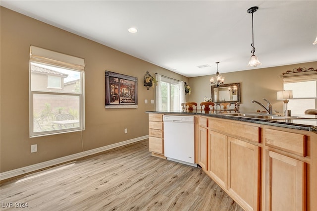 kitchen with light wood-type flooring, a chandelier, decorative light fixtures, white dishwasher, and sink