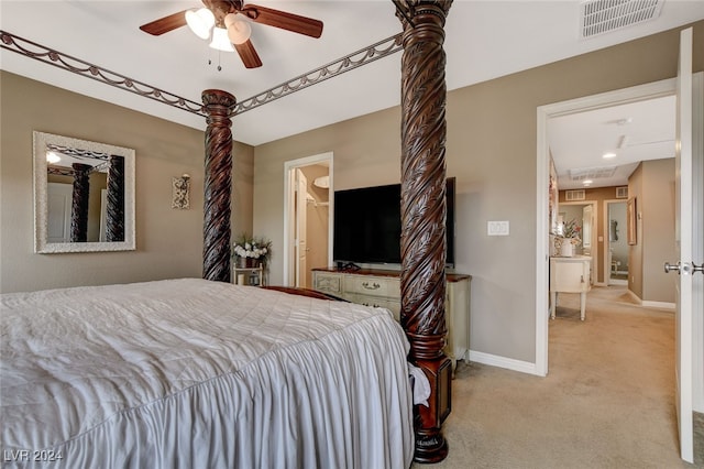 bedroom with ceiling fan and light colored carpet