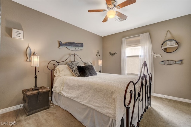 carpeted bedroom featuring ceiling fan and vaulted ceiling