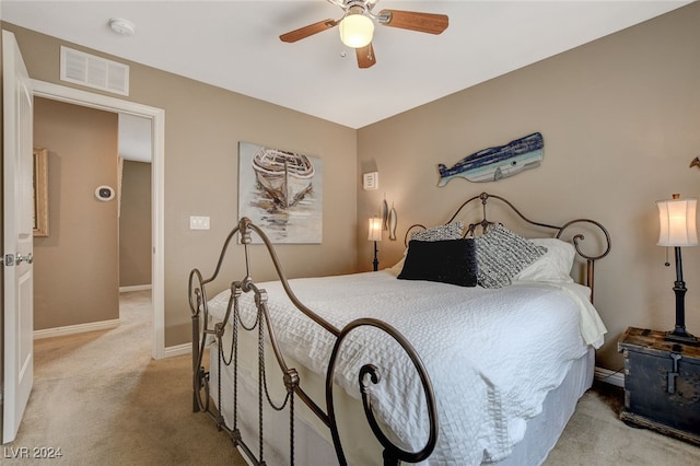 bedroom featuring light carpet and ceiling fan