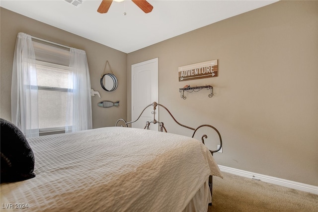 bedroom with ceiling fan and carpet flooring