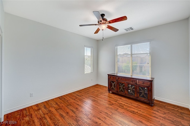 unfurnished room featuring ceiling fan and hardwood / wood-style flooring