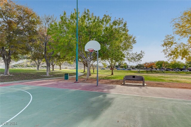 view of basketball court featuring a lawn