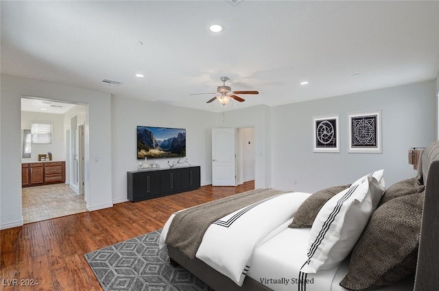 bedroom with ceiling fan and hardwood / wood-style flooring